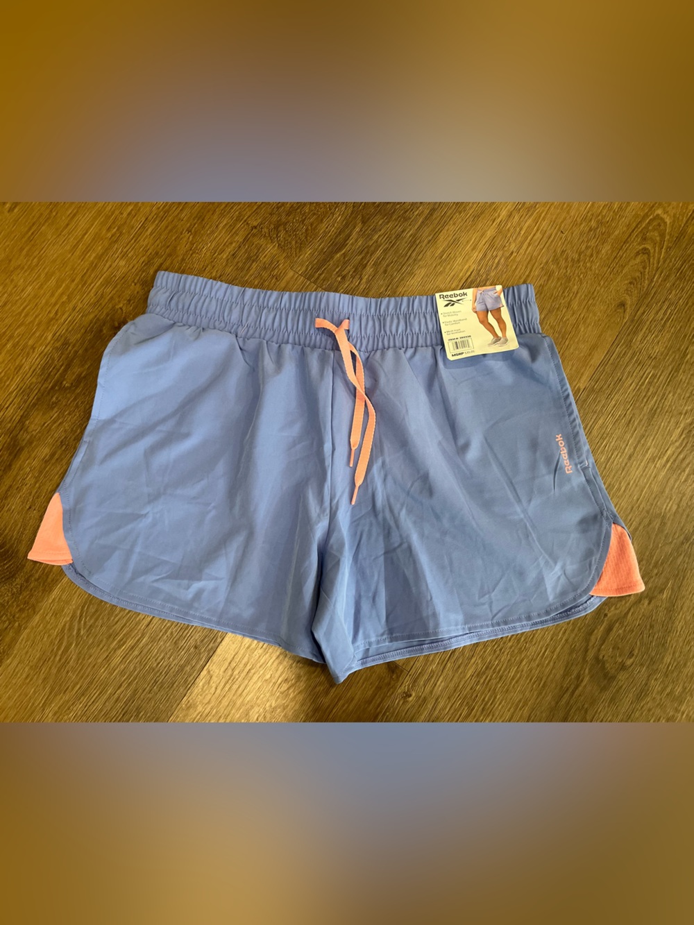 Reebok Women’s Light Blue Athletic Shorts with Pink Accents